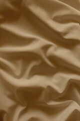 Light-brown crumpled fabric background