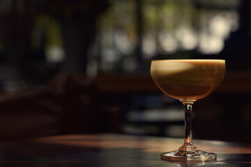 Warm coffee cup in a special tall glass with copy space.