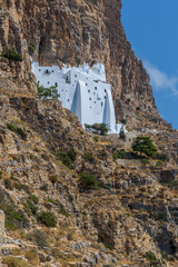 The famous Hozoviotissa Monastery standing on a rock over the Aegean sea in Amorgos island,...