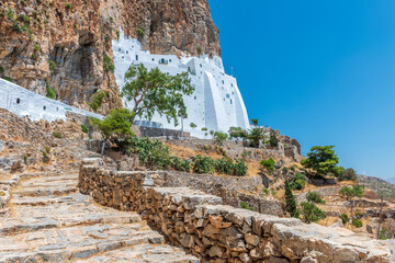 The famous Hozoviotissa Monastery standing on a rock over the Aegean sea in Amorgos island,...