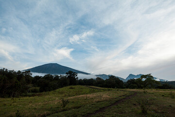 Beautiful landscape of mount Rinjani surrounded by clouds, Lombok, Indonesia