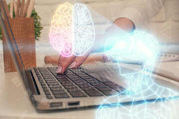 Double exposure of woman hands typing on computer and man in AR glasses drawing. Education concept.