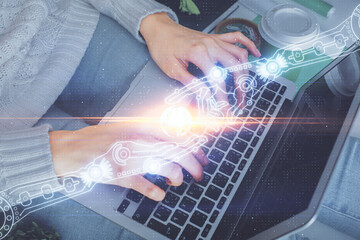 Double exposure of woman hands working on computer and data theme hologram drawing. Tech concept.
