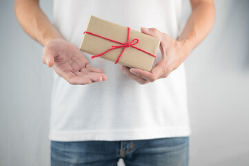 Closeup hand holding gift box, new year gift box, Christmas gift box ,copy space. Christmas, hew year, birthday concept.