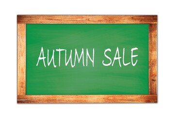 AUTUMN  SALE text written on green school board.