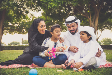 Fototapeta premium Happy family spending time together outdoor in Dubai