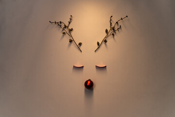 Christmas background of a cute reindeer concept made of decorations with copy space for text. Party...