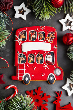 Homemade Gingerbread red Christmas bus with reindeer and Santa.