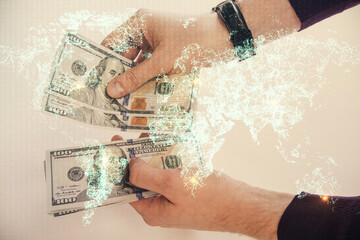 Multi exposure of social network theme drawing hologram and USA dollars bills and man hands.