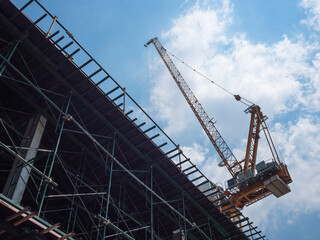 Fototapeta na wymiar Cranes working Building Construction site Architecture Industrial 