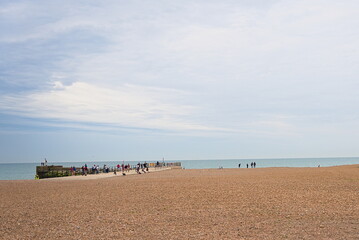 View to the sea and the pier from pebbles beach.