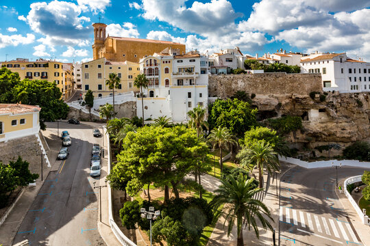 Spain, Balearic Islands, Mahon, View of Parc Rochina in summer with Casa Mir and Esglesia de Santa Maria de Mao in background
