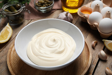 Composition with ingredients for tartar sauce on wooden table, closeup