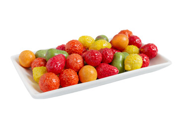Fototapeta na wymiar Chewing colorful gum in the form of fruit on a plate isolated on white background. Close up