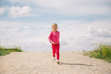 girl with glasses running