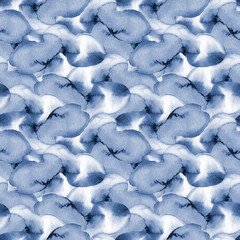 Decorative Christmas seamless pattern of abstract watercolor spots in light blue indigo colour. Winter hand painted texture.