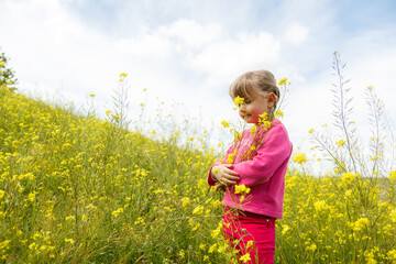 little blondie girl picking flowers