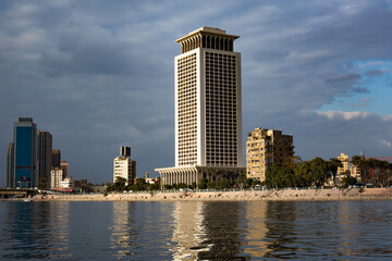 View of modern Cairo with tall skyscrapers from a pleasure boat on the Nile River