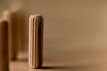 A row of wooden dowels. for furniture and accessories