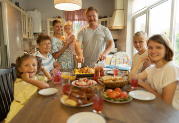 big family at the dinner table .