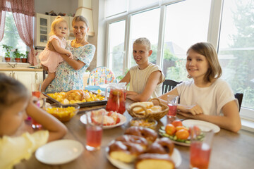 big family at the dinner table .