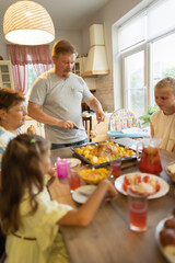 big family at the dinner table .