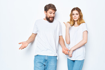 Fototapeta premium young couple white t-shirts fun lifestyle posing communication