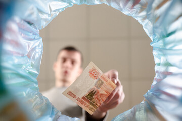 Throw a ruble into the trash can.Throwing the ruble