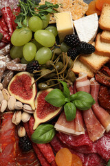 Set of different delicious appetizers as background, top view