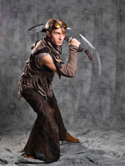 Steampunk or post-apocalyptic style character, with an unusual cold weapon