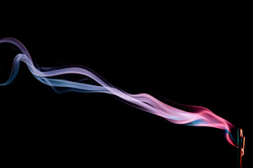 Abstract colorful smoke on a black background. Isolated.