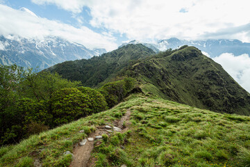 Fototapeta na wymiar Narrow footpath on the mountain ridge. Trek to Machapuchare, Nepal