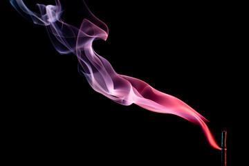 Abstract colorful smoke on a black background. Isolated.