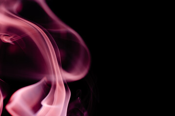 Obraz premium Abstract colorful smoke on a black background. Isolated.