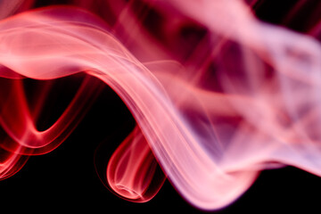 Abstract colorful smoke on a black background. Isolated.