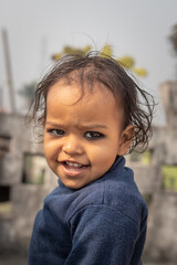 small kid cute smiling face close up shot from flat angle