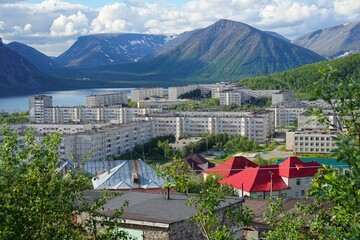 Russia, Murmansk region. Kirovsk. View of the residential part of the city of Kirovsk on a summer day. Khibiny mountains and lake 