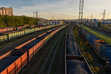 Fototapeta na wymiar open freight cars with coal at railway station in Murmansk, Russia