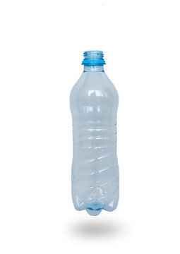 Plastic empty, transparent bottle, on a light background with a shadow