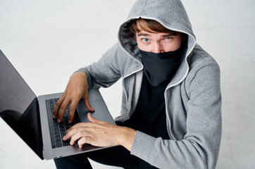 hacker stealth technique robbery safety hooligan light background