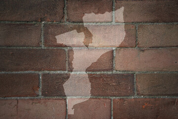 map of mozambique on a old brick wall