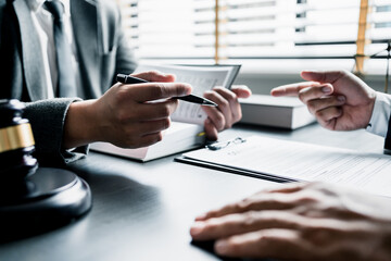 Close up of businessmen or lawyers discussing contract or business agreement at law firm office, Business people making deal document legal, justice advice service concept.