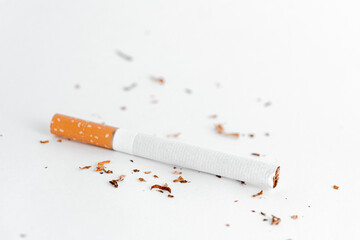 Cigarette on a white background reclining position.