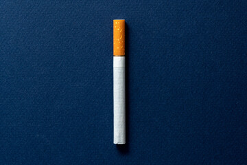 One cigarette evenly spaced on a dark blue background.