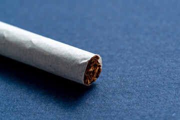 Close-up of the very edge of a cigarette.