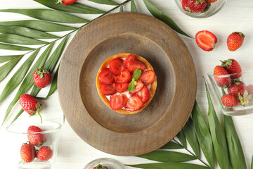 Concept of delicious food with strawberry tart, top view