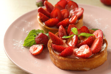 Concept of delicious food with strawberry tarts, close up