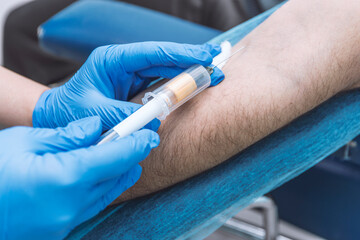 Nurse taking a blood sample, close up