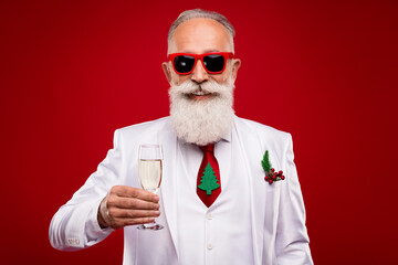 Photo of nice aged white hair man hold champagne wear eyewear white jacket isolated on red color...