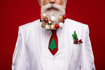 Cropped photo of old serious cool man wear beard balls christmas decor suit isolated on red color...